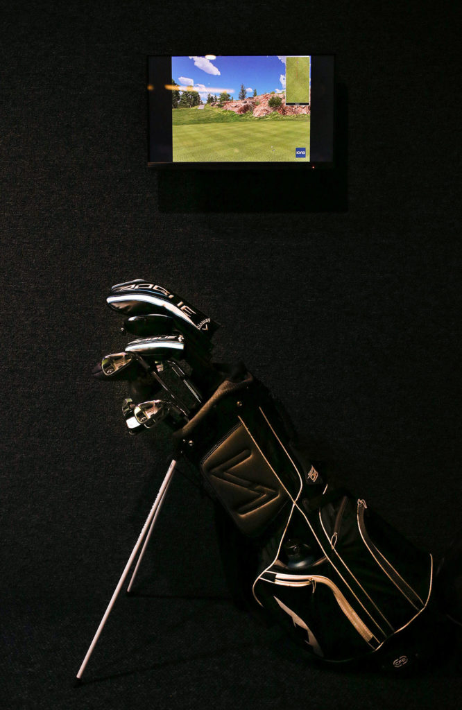 Players bring their own clubs to golf at Back9 Parlor. (Andy Bronson / The Herald)
