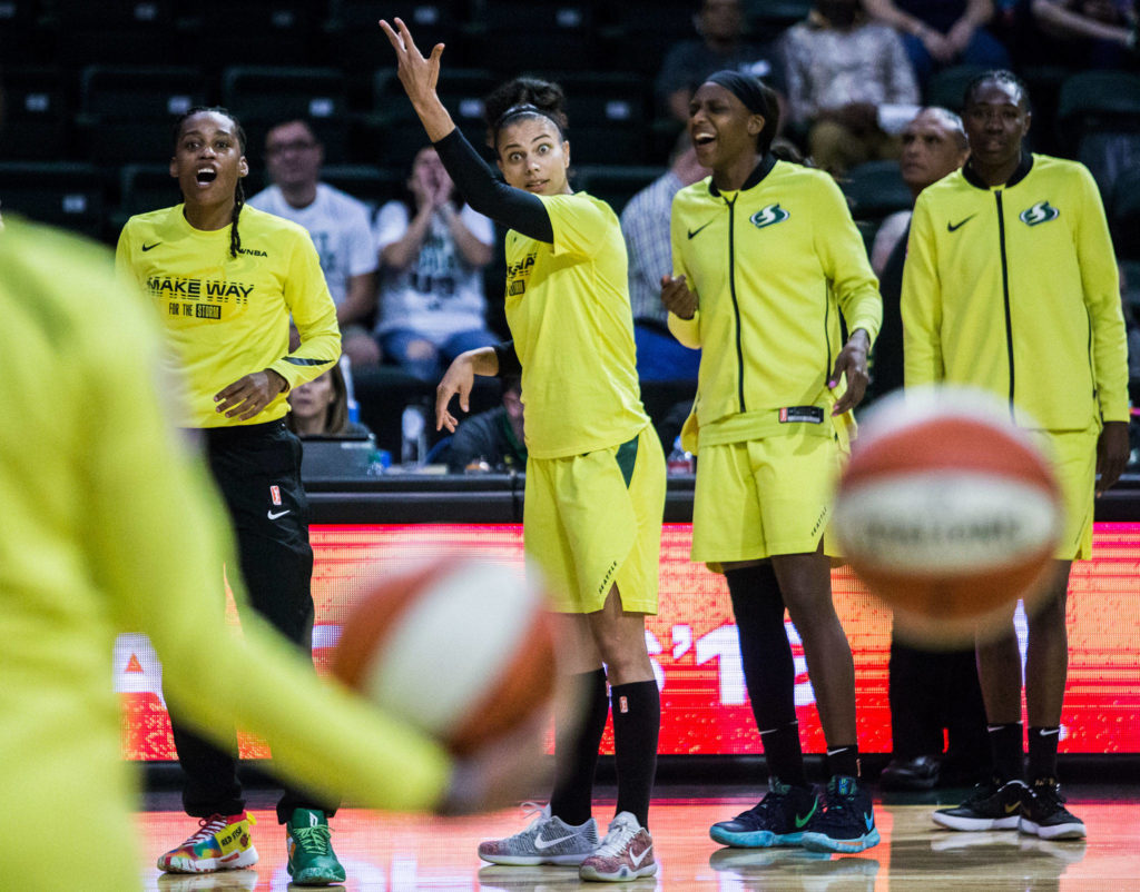 Seattle Storm’s Shavonte Zellous, Alysha Clark and Crystal Langhorne joke around during warm-ups before the game against the Minnesota Lynx on Wednesday, Sept. 11, 2019 in Everett, Wash. (Olivia Vanni / The Herald)
