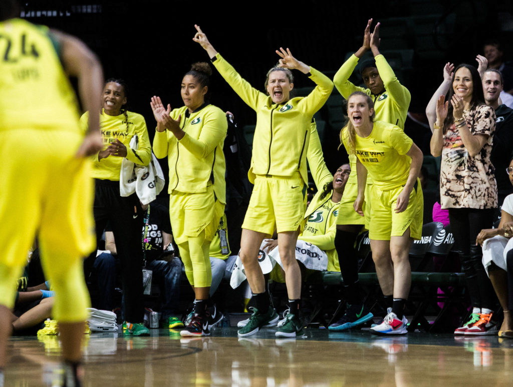 The Seattle Storm bench facts to Jewel Lloyd making a three-point shot during the game against the Minnesota Lynx on Wednesday, Sept. 11, 2019 in Everett, Wash. (Olivia Vanni / The Herald)
