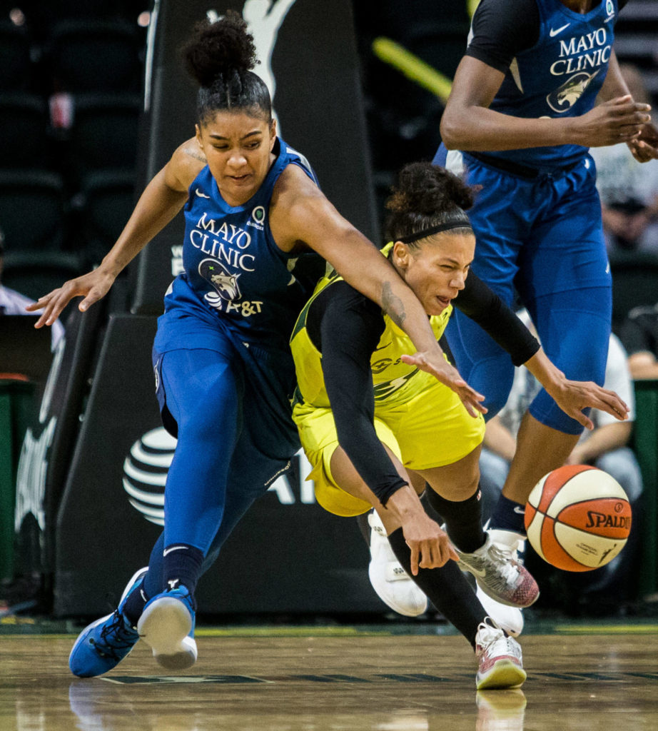 Seattle Storm’s Alysha Clark scrambles for the ball during the game against the Minnesota Lynx on Wednesday, Sept. 11, 2019 in Everett, Wash. (Olivia Vanni / The Herald)
