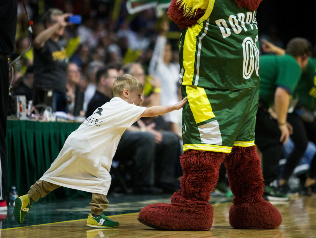 A fan reaches out to touch Doppler during the game against the Minnesota Lynx on Wednesday, Sept. 11, 2019 in Everett, Wash. (Olivia Vanni / The Herald)
