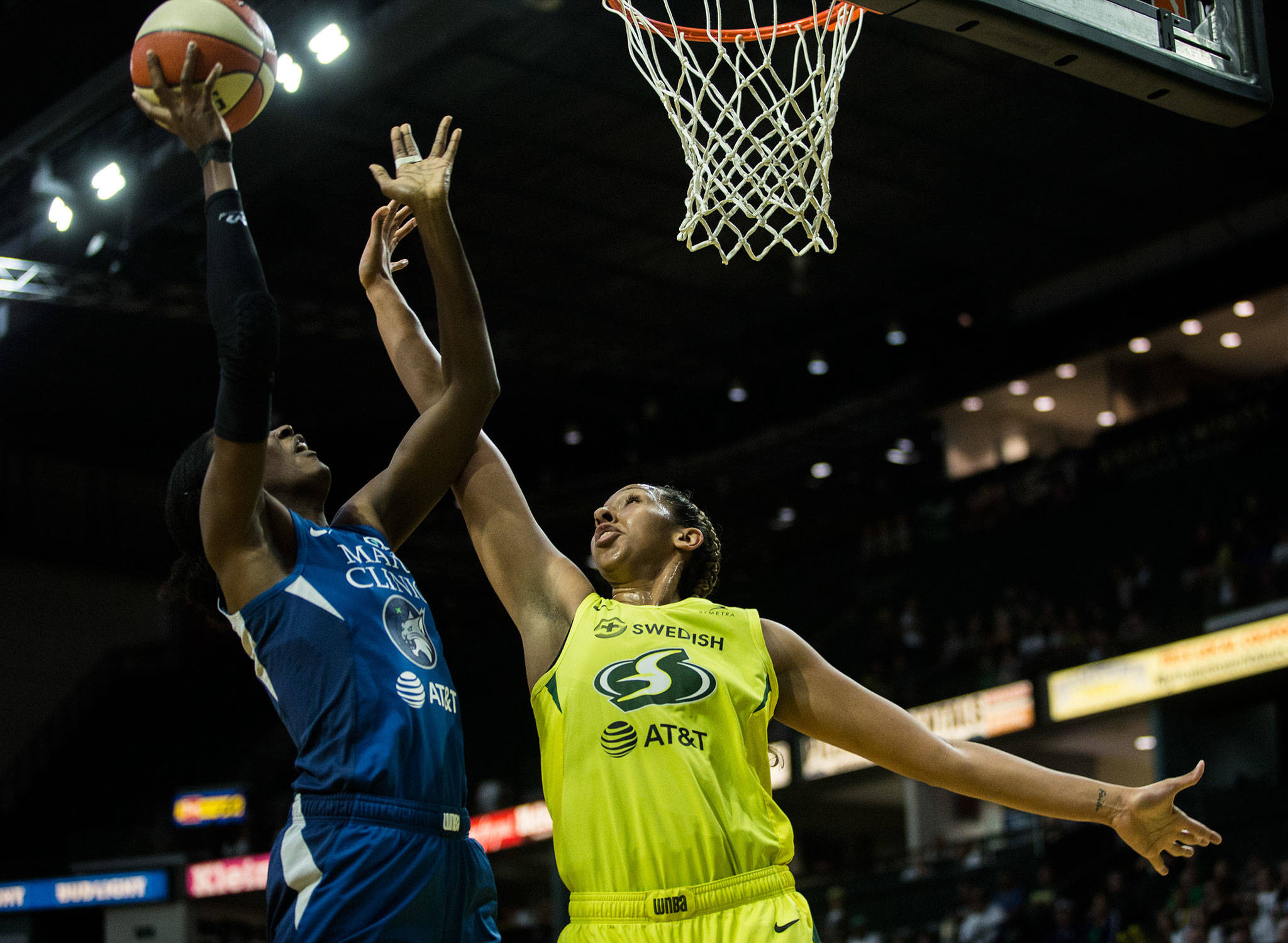 The Storm’s Mercedes Russell (right) blocks a shot during a playoff game against the Lynx on Wednesday in Everett. (Olivia Vanni / The Herald)