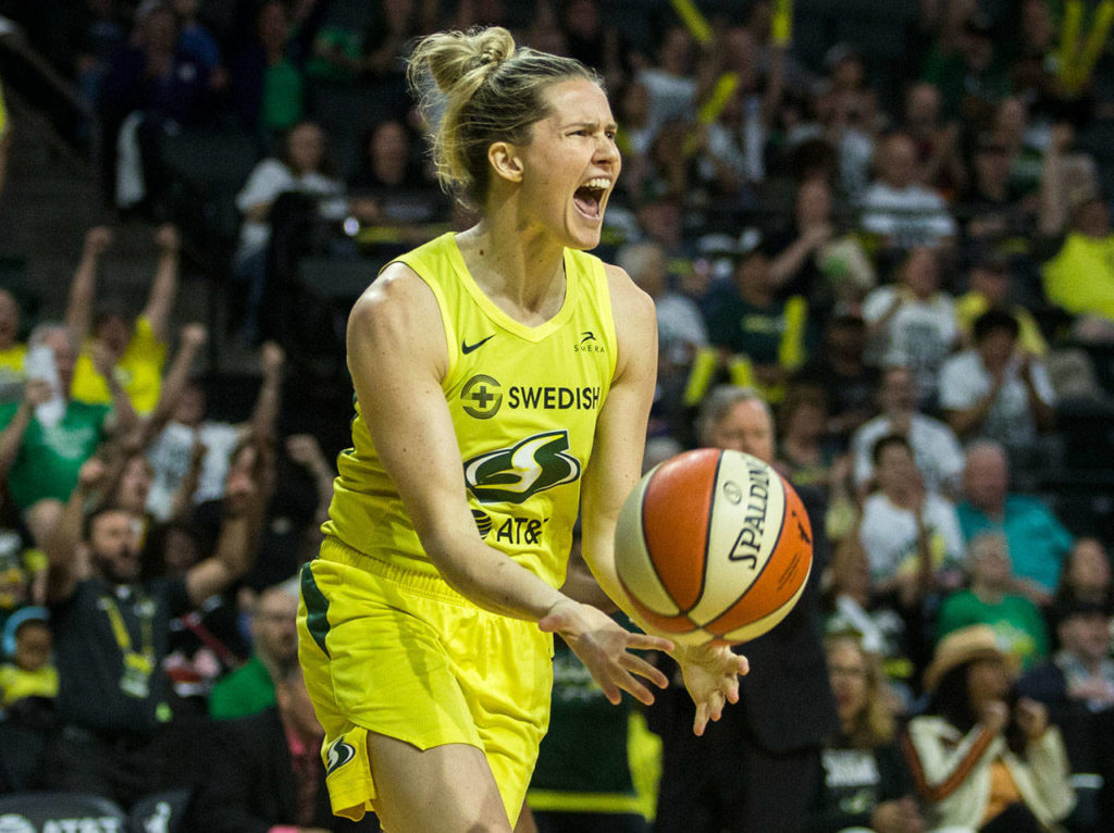 The Storm’s Sami Whitcomb yells after a teammate makes a shot during a playoff game against the Lynx on Wednesday in Everett. (Olivia Vanni / The Herald)
