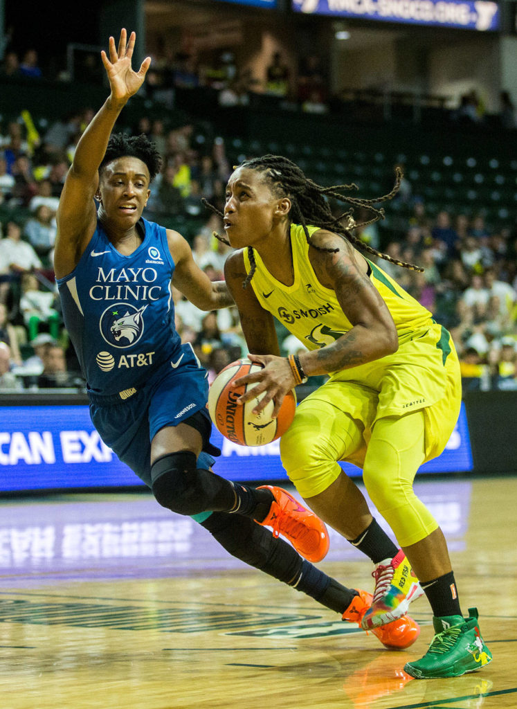 The Storm’s Shavonte Zellous (right) attempts a shot during a playoff game against the Lynx on Wednesday in Everett. (Olivia Vanni / The Herald)
