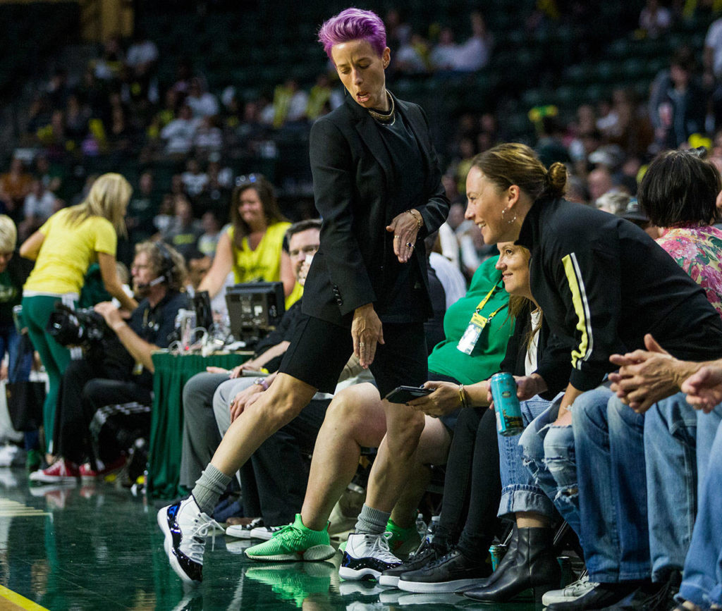 USWNT’s Megan Rapinoe shows off her shoes during the game against the Minnesota Lynx on Wednesday in Everett. (Olivia Vanni / The Herald)
