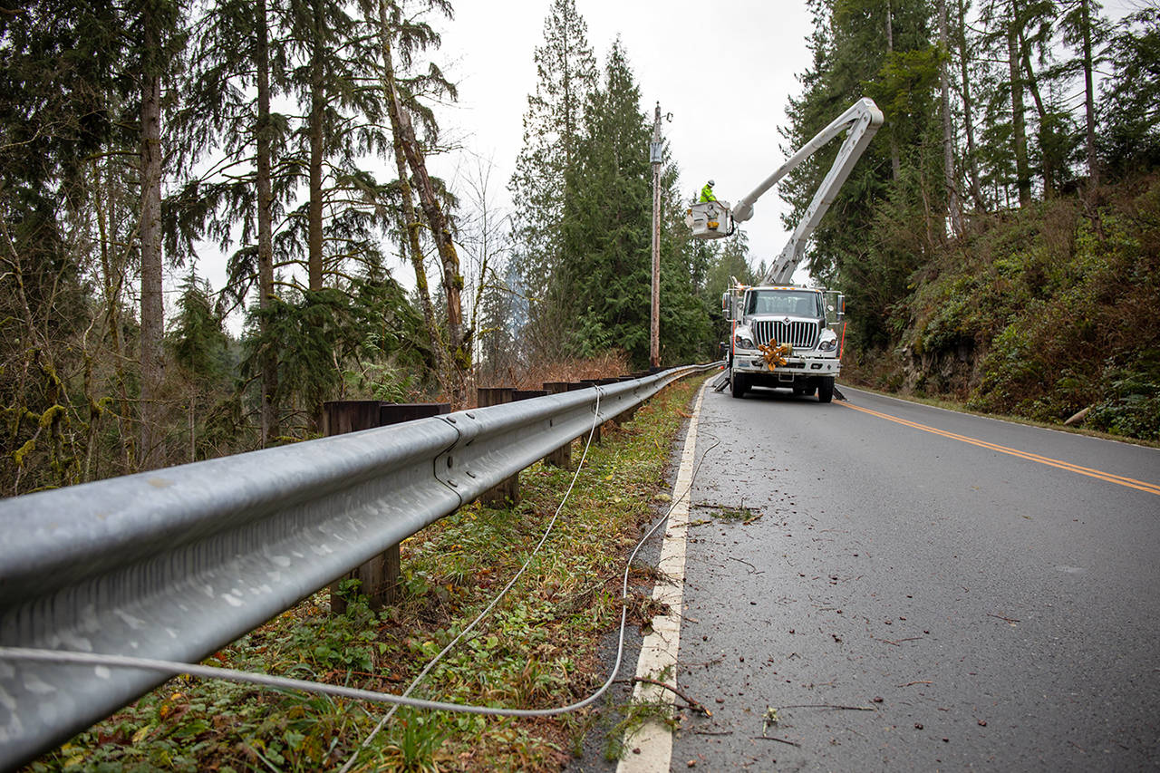 Snohomish PUD lineworkers make repairs to a downed power line during storm restoration in the Sky Valley last winter. (Snohomish County PUD, file)