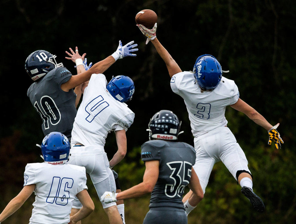 Shorewood’s Spencer Osborn (3) blocks a pass to Meadowdale’s Colton Walsh (left) during a game on Sept. 13, 2019, at Edmonds Stadium. (Olivia Vanni / The Herald)

