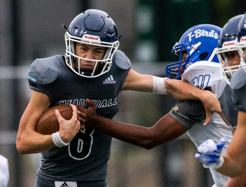 Meadowdale’s Hunter Moen runs the ball during a game against Shorewood on Sept. 13, 2019, at Edmonds Stadium. (Olivia Vanni / The Herald)
