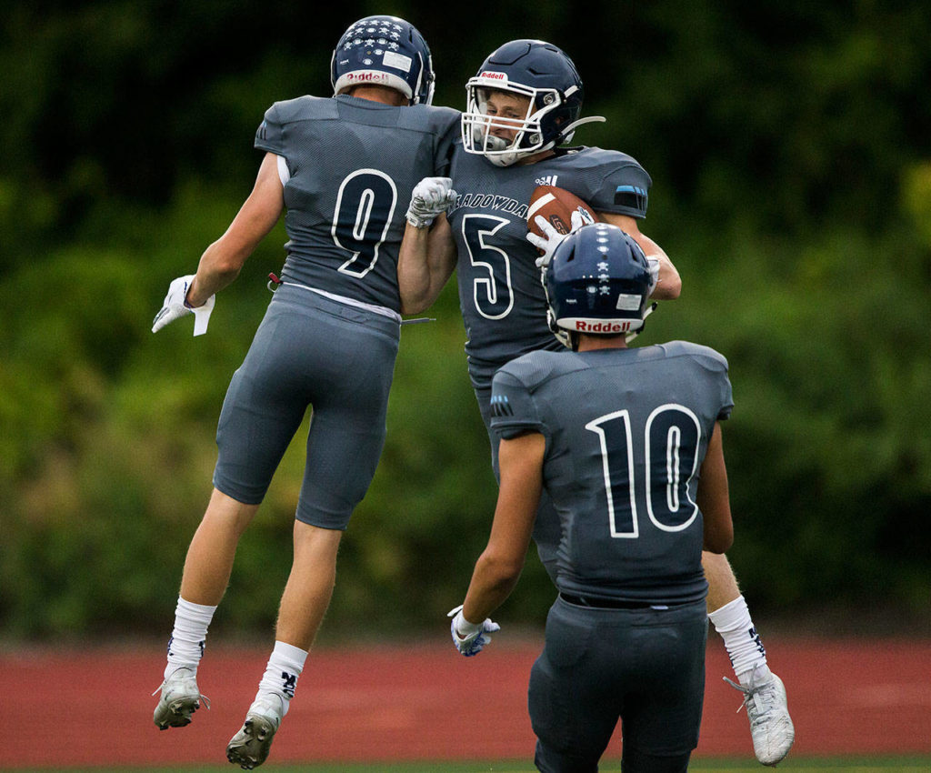 Meadowdale’s Kristian Lunsford (5) celebrates after his touchdown during a game against Shorewood on Sept. 13, 2019, at Edmonds Stadium. (Olivia Vanni / The Herald)
