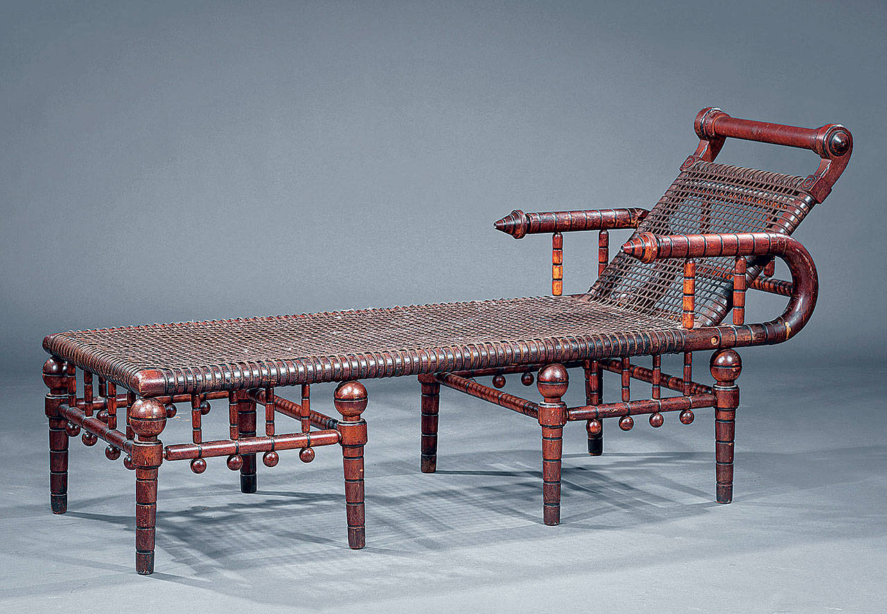 This unusual daybed was invented and patented by George Hunzinger in 1879. It sold for $3,125 because of the historic look, the importance of the maker and the remains of the original fabric-wrapped wire used instead of upholstery. (Cowles Syndicate Inc.)