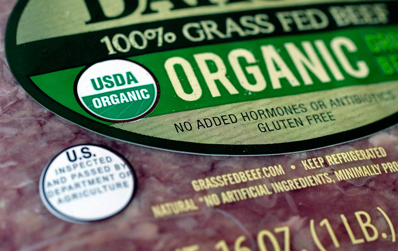 Labels such as “Fair Trade Certified ” or “USDA Organic” signify that a product’s supply chain has gone through some level of vetting. However, standards can vary widely. (AP Photo/Steven Senne, File)