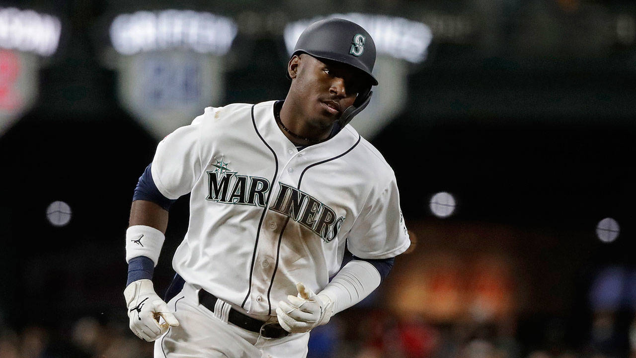 The Mariners’ Kyle Lewis (30) rounds the bases after hitting a solo home run during the fifth inning of a game against the Reds on Sept. 10, 2019, in Seattle. (AP Photo/Ted S. Warren)