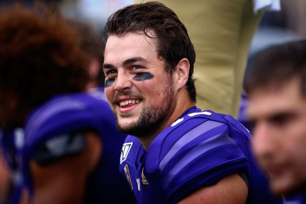 Washington’s Jacob Eason is all smiles in route to their 52-20 victory over Hawai’i Saturday evening at Husky Stadium in Seattle on September 14, 2019. (Kevin Clark / The Herald)

