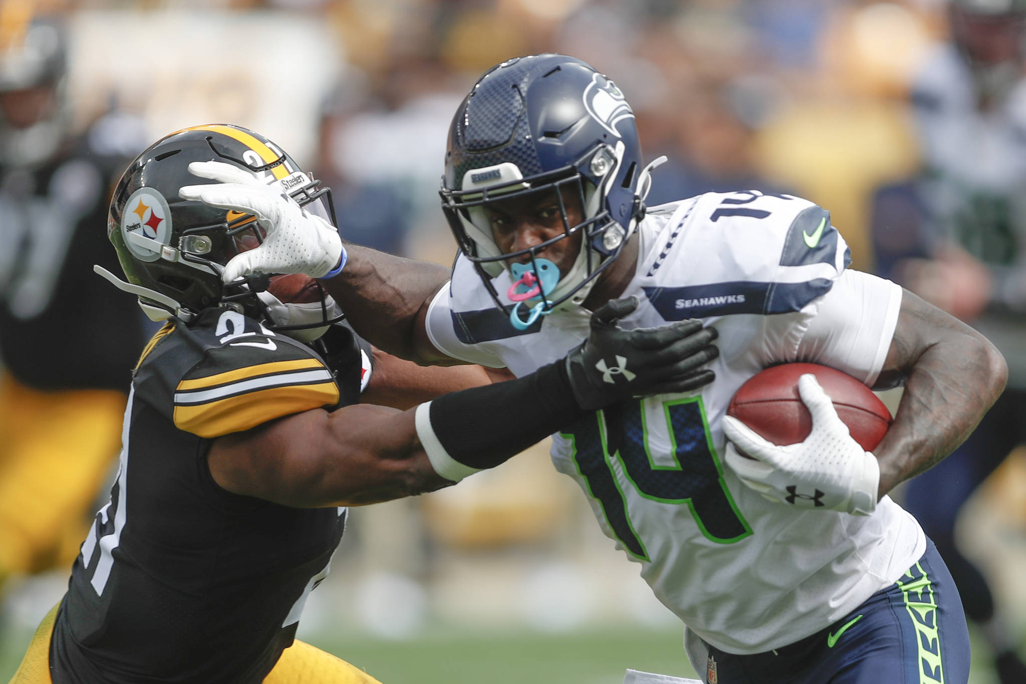 Seattle Seahawks rookie wide receiver DK Metcalf stiff arms Pittsburgh free safety Sean Davis after making a catch in the second half of Sunday’s NFL game in Pittsburgh. (AP Photo/Don Wright)