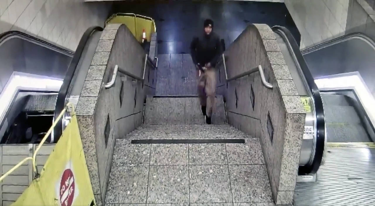 Detectives released surveillance video from the Westlake Station shooting, in which the suspect is shown fleeing tunnel with gun after the shooting. (Seattle Police Department)