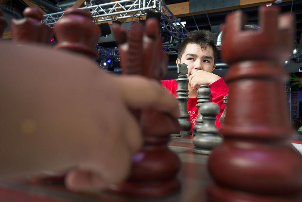 Davian Calkins watches as his opponent considers moving a knight during a chess game on Wednesday at the new multimedia teen center at the Tulalip Boys Girls Club. (Andy Bronson / The Herald)
