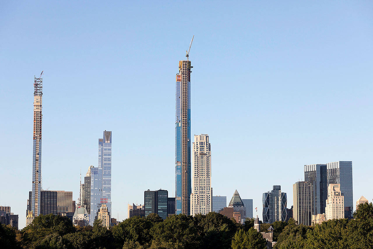 The Central Park Tower, center, is under construction, Tuesday in New York. At 1550 feet the tower is the world’s tallest residential apartment building, according to the developer, Extell Development Co. (AP Photo/Mark Lennihan)