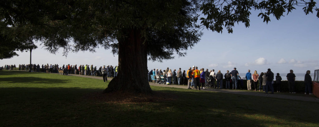 Grand Avenue Park is lined with bystanders as the $20 million Grand Avenue Park Bridge is slowly rotated into place along W Marine View Drive in Everett on Wednesday. (Andy Bronson / The Herald)
