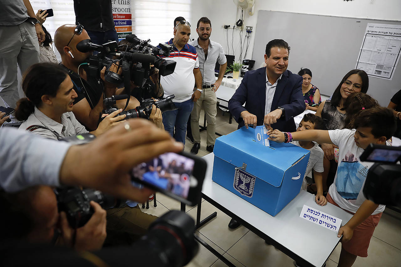 In this Sept. 17 photo, Israeli Arab politician Ayman Odeh casts his vote in Haifa, Israel. Israel’s Arab coalition appears poised to emerge as the main opposition bloc following Tuesday’s vote. (AP Photo/Ariel Schalit, File)