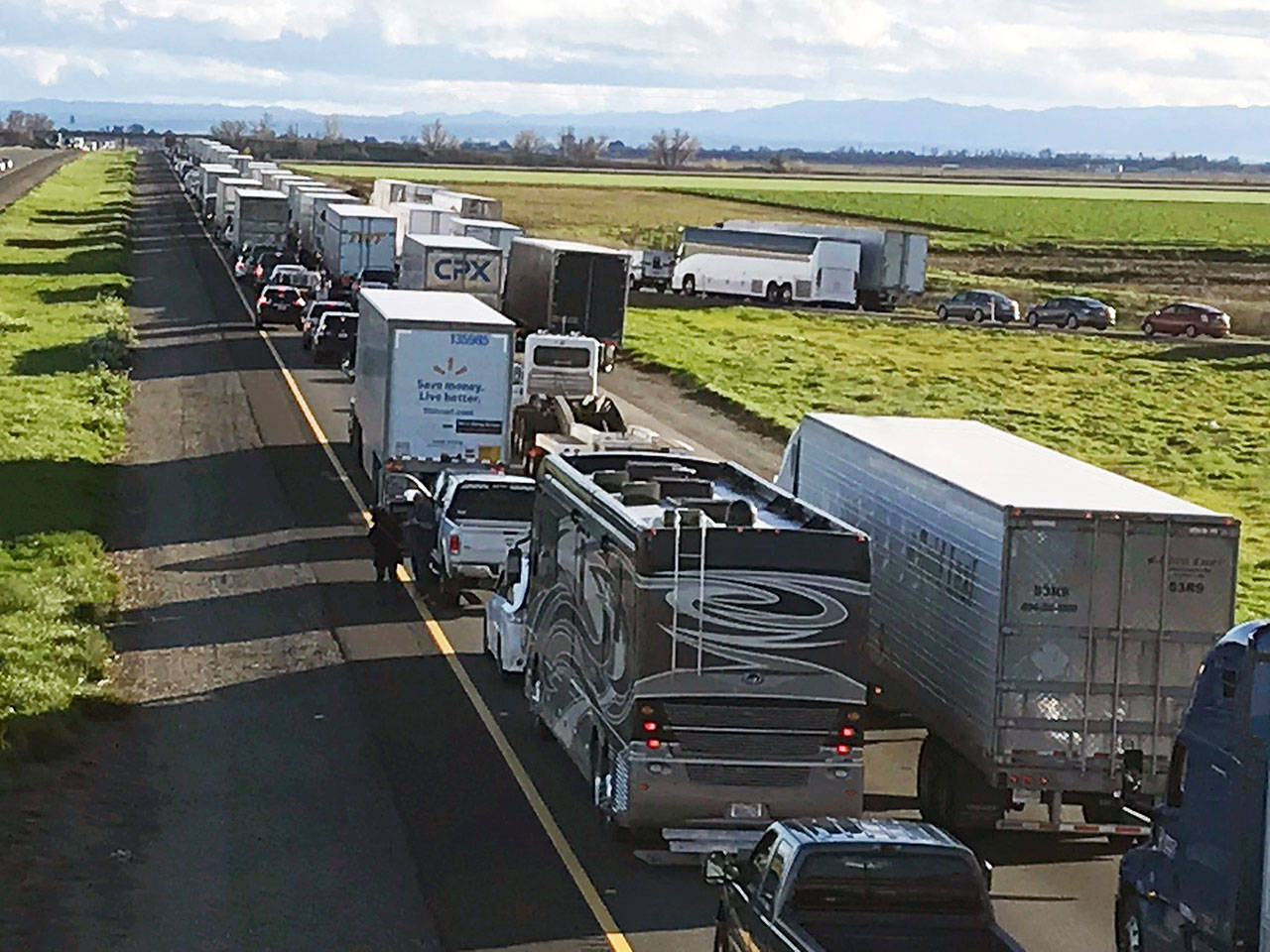 This Feb. 14 photo shows a 7-mile back up on southbound I-5 as it reopens to traffic in Maxwell in Colusa County, California. The Trump administration is poised revoke California’s authority to set auto mileage standards, asserting that only the federal government has the power to regulate greenhouse gas emissions and fuel economy. (Caltrans District 3 via AP)