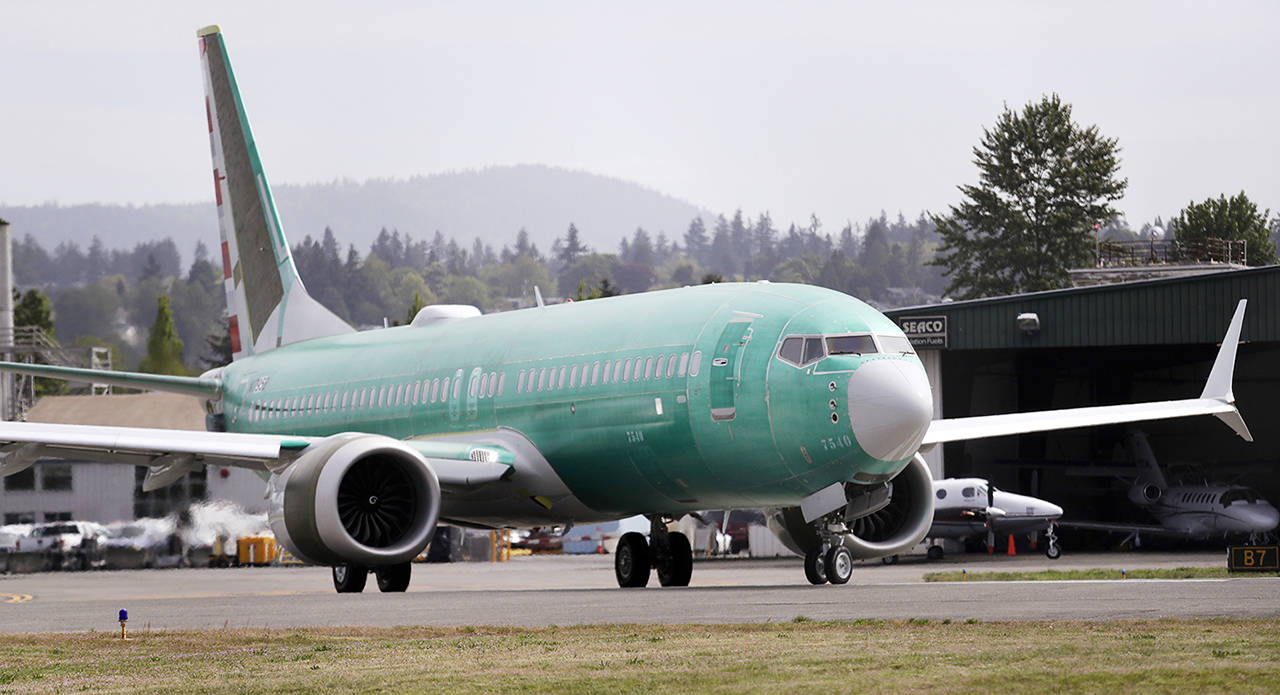 In this May 8 photo, a Boeing 737 MAX 8, being built for American Airlines, makes a turn on the runway as it’s readied for takeoff on a test flight in Renton. (AP Photo/Elaine Thompson, File)