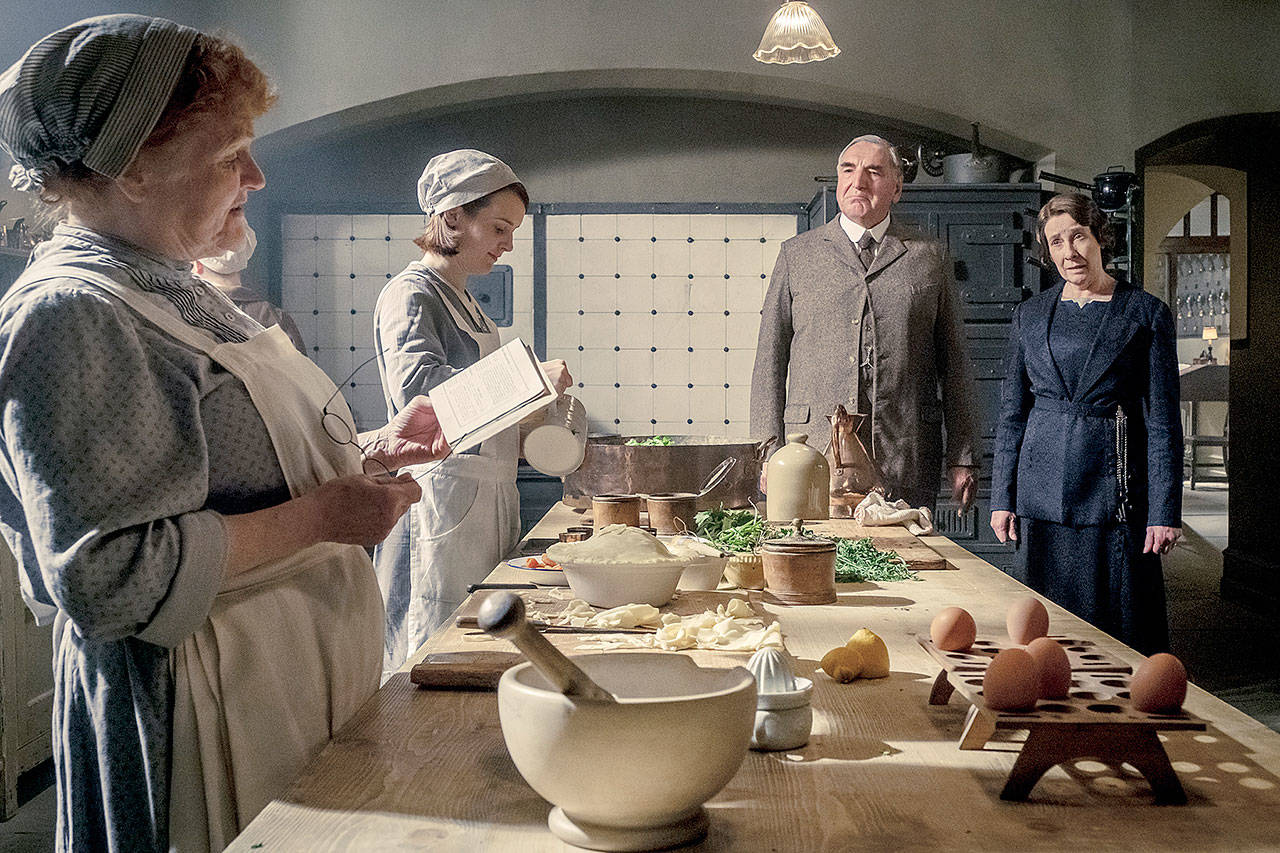 The royals are coming, so it’s pandemonium in the “Downton Abbey” kitchen. From left is Lesley Nicol as Mrs. Patmore, Sophie McShera as Daisy, Jim Carter as Mr. Carson and Phyllis Logas as Mrs. Hughes. (Focus Features)