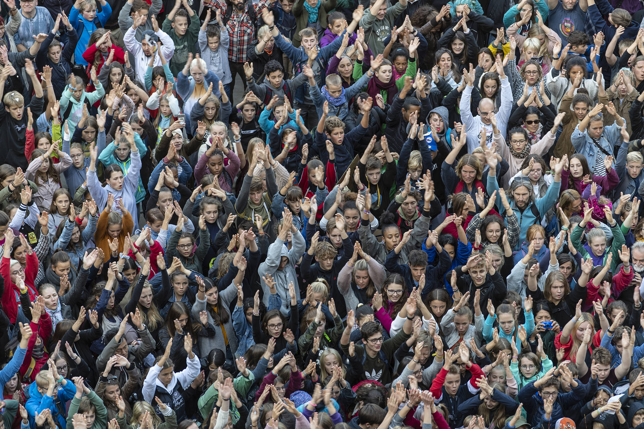 People attend a ‘Fridays For Future’ rally in Freiburg, Germany, on Friday. Protests of the ‘Fridays For Futurte’ movement against the increase of carbon dioxide emissions are planned Friday in cities around the globe. In the United States more than 800 events are planned. (Patrik Seeger/dpa via AP)
