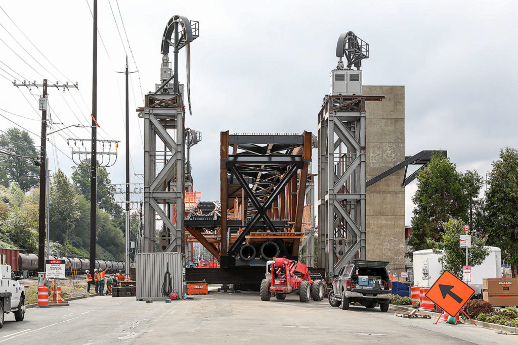 Crew prepare to lift the Grand Avenue Park Bridge midday Saturday. (Lizz Giordano / The Herald)
