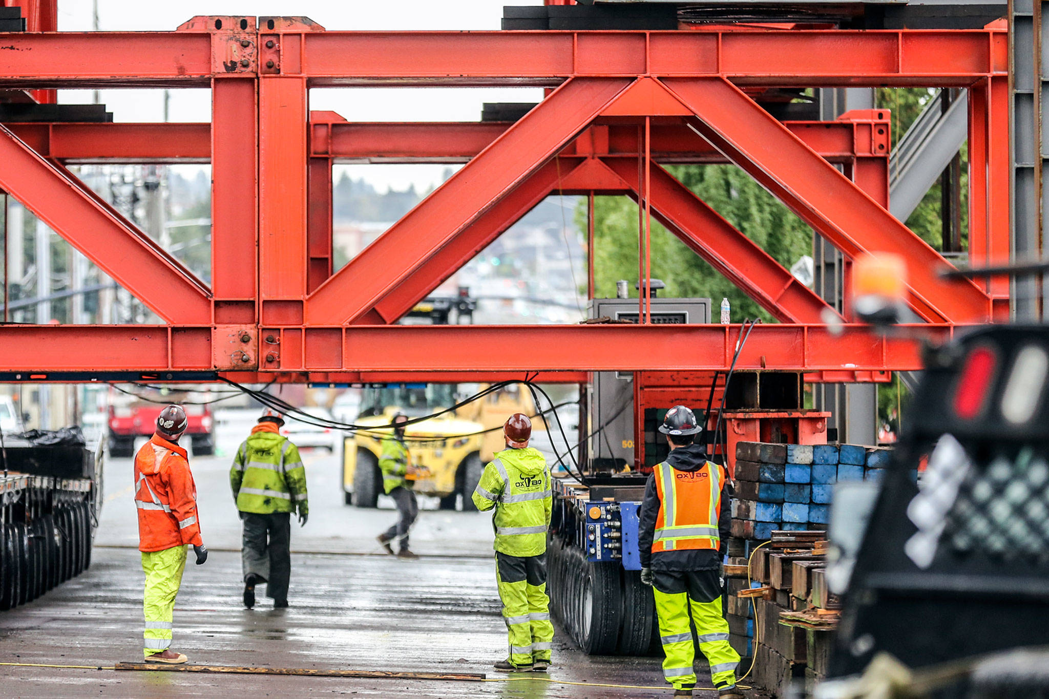 Work continues Monday in Everett on the Grand Avenue Bridge in preparation for the move later this week. (Kevin Clark / The Herald)