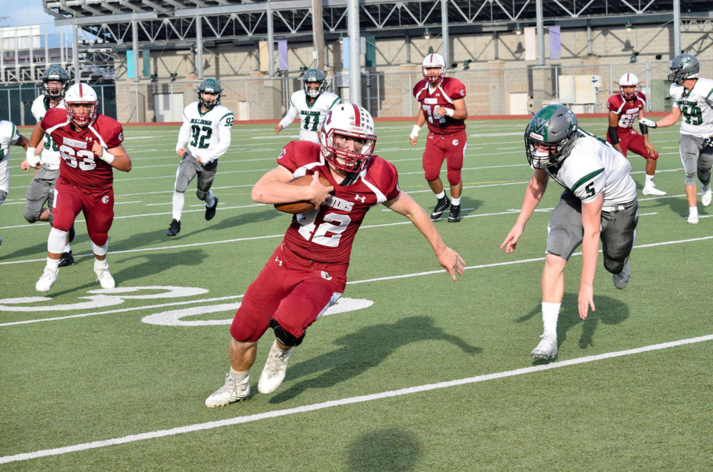 Sophomore running back Ronan Mckague runs for a first down against Mount Vernon on Friday, Sept. 20 at Everett Memorial Stadium. (Katie Webber / The Herald)
