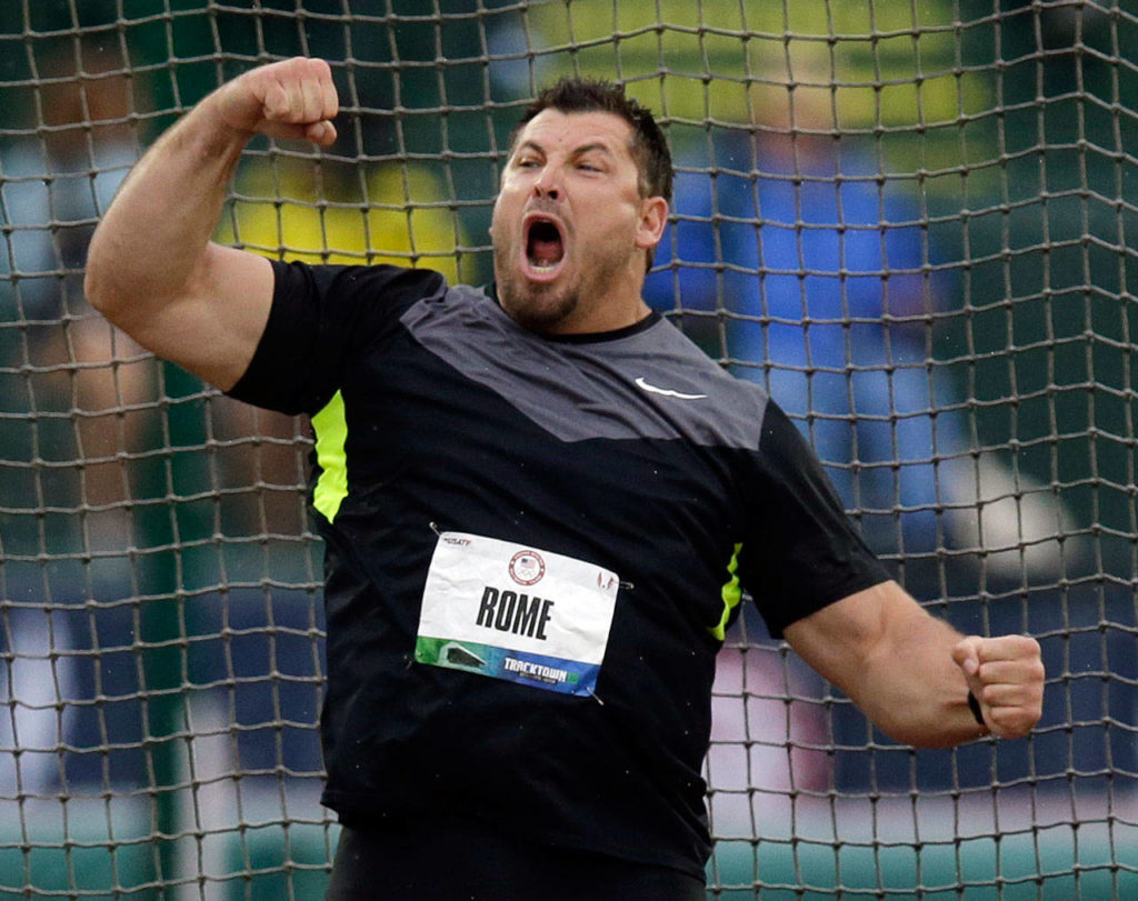 Jarred Rome celebrates his second-place finish in the men’s discus final June 28, 2012 at the U.S. Olympic Track and Field Trials in Eugene, Ore. The Marysville-Pilchuck High School class of 1995 alumnus died Saturday. He was 42. (AP Photo/Charlie Riedel)
