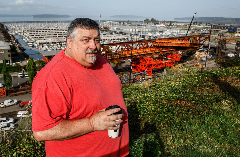 Before the bridge was in place Wednesday morning, Ken Wartz talked about how he used to take a stairway to the waterfront. (Dan Bates / The Herald)
