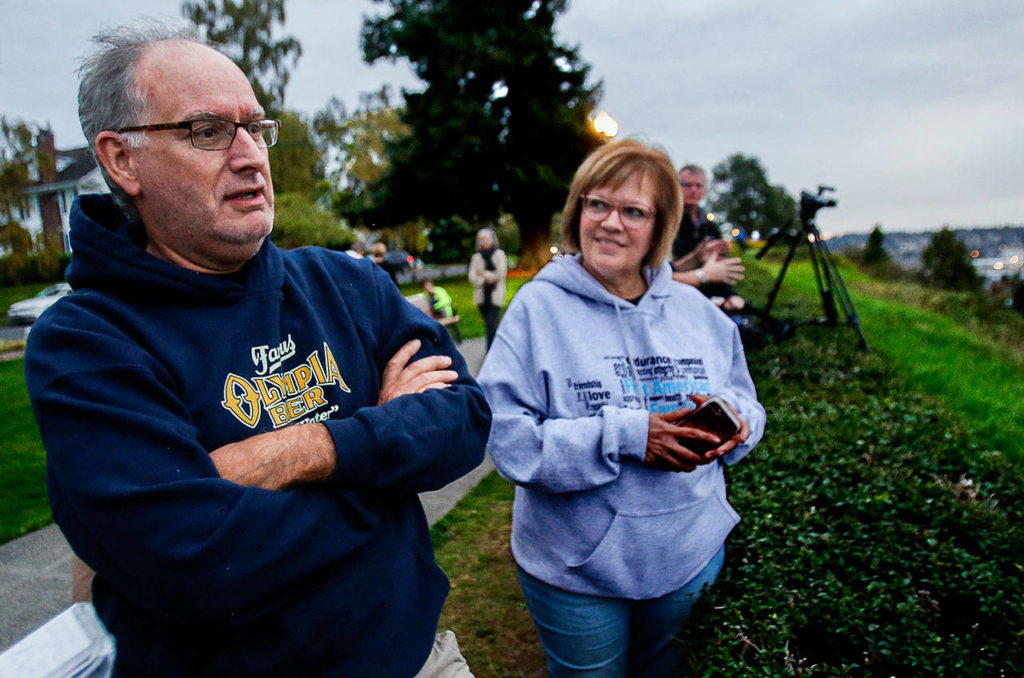 Allan White, with his wife, Leann, recalled taking a little trail over the bluff with his grandfather to collect mushrooms. (Dan Bates / The Herald)
