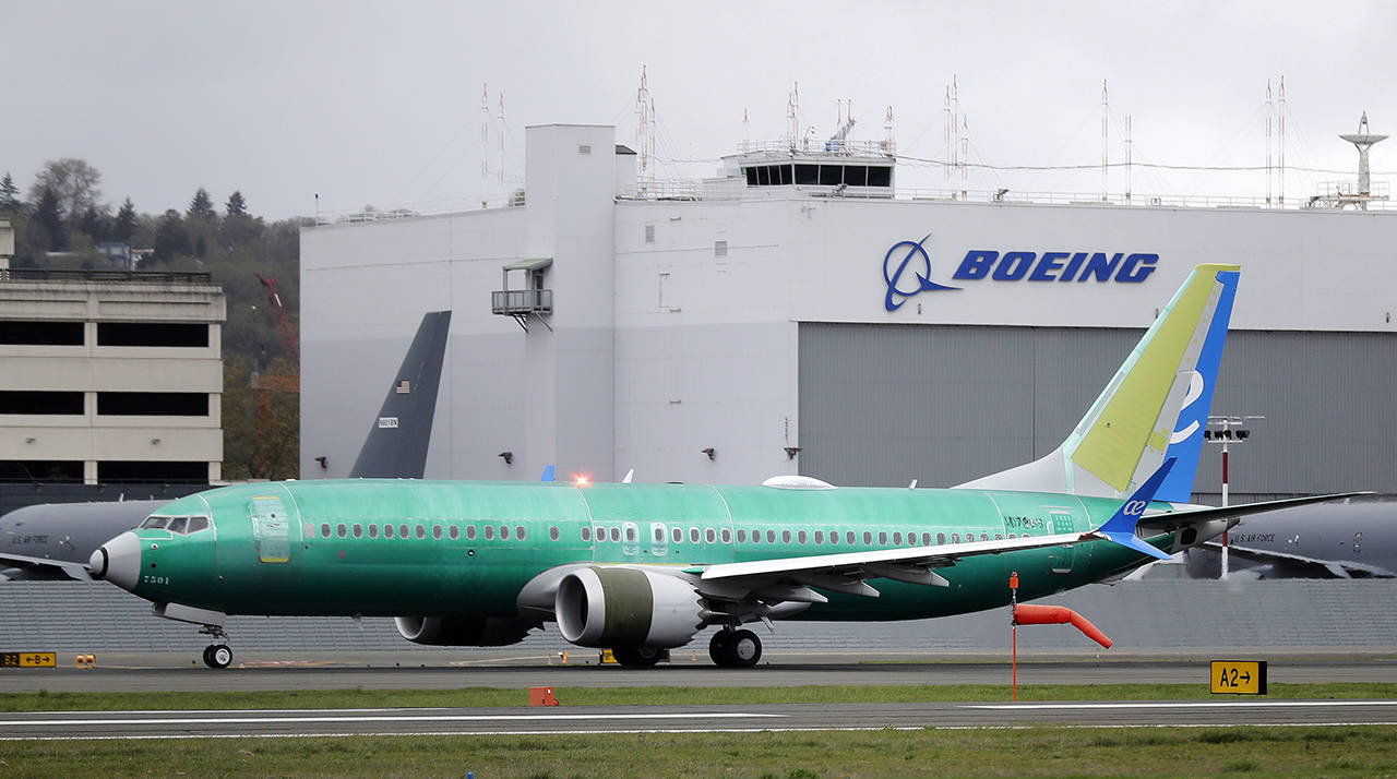 In this April 10 photo, a Boeing 737 MAX 8 airplane being built for Spain-based Air Europa rolls toward takeoff before a test flight at Boeing Field in Seattle. (AP Photo/Ted S. Warren, File)