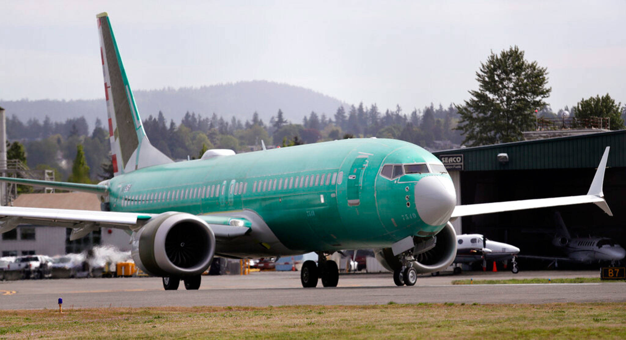 A Boeing 737 Max 8, being built for American Airlines, makes a turn on the runway as it’s readied for takeoff on a test flight in Renton, in May. American Airlines says it is delaying the expected return date for its Boeing 737 Max jets. The airline said Sunday, Sept. 1, that while it “remains confident” that coming software updates and training will mean recertification of the aircraft this year, it is extending cancellations for Max flights through Dec. 3. (Elaine Thompson / Associated Press file photo)