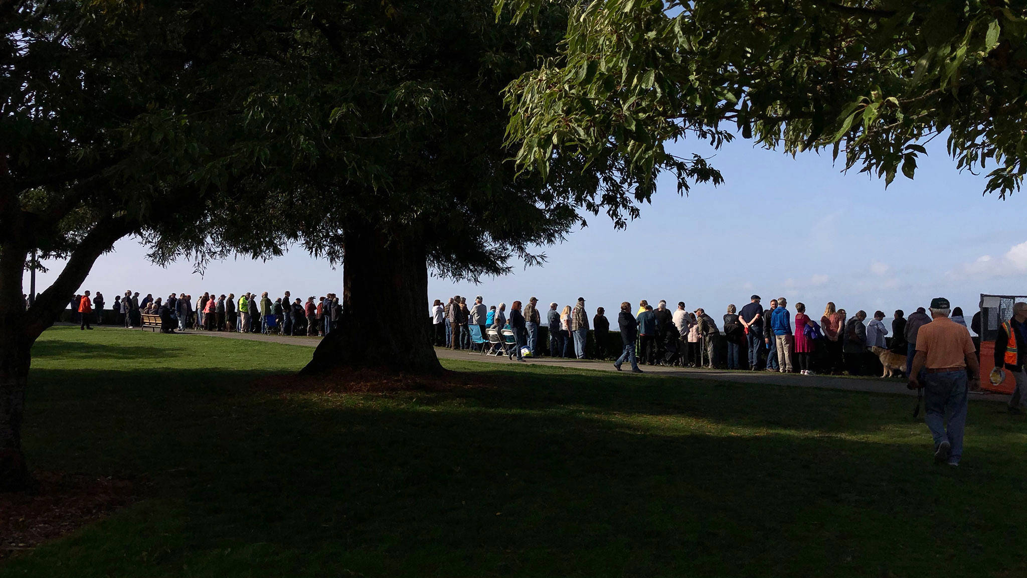 The crowd grows bigger and bigger at the Grand Ave. Park on Wednesday morning. (Andy Bronson / The Herald)
