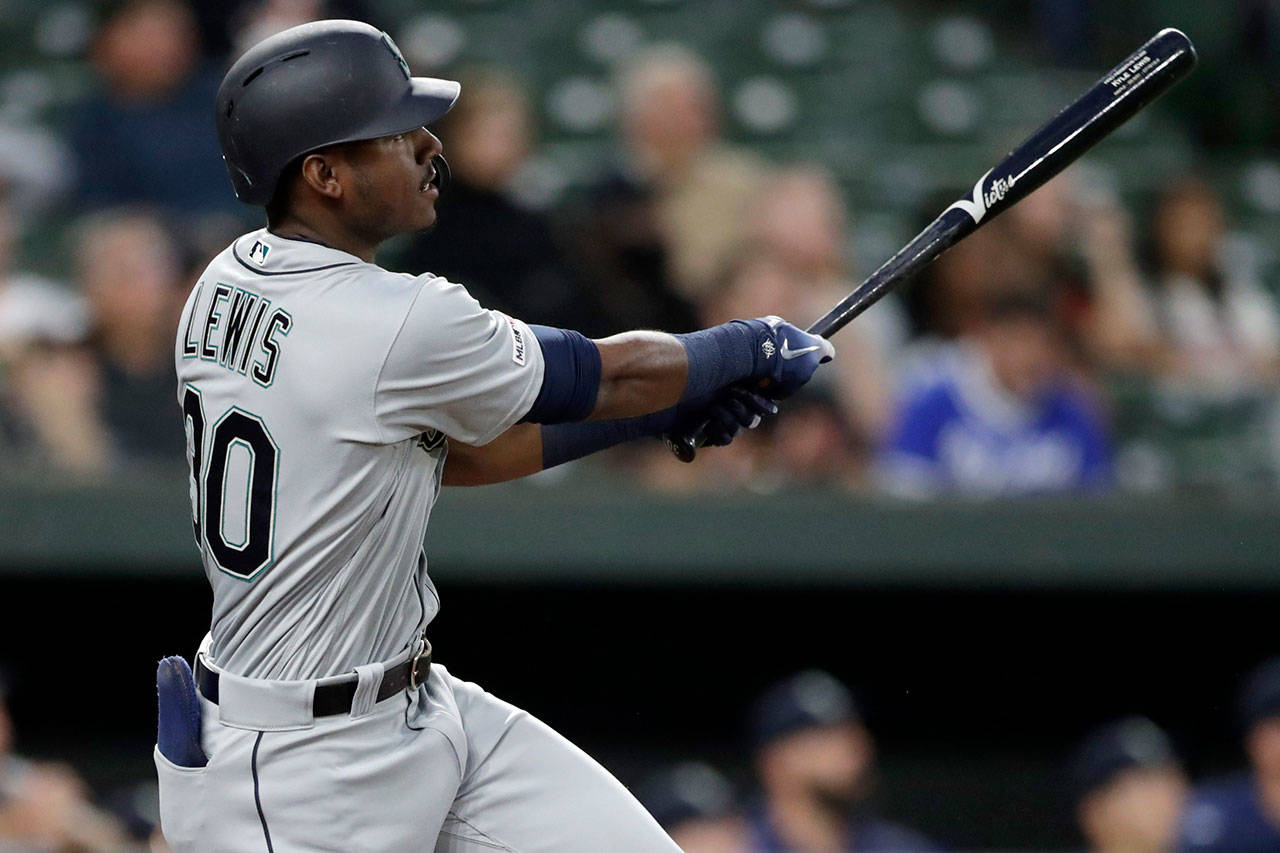 The Mariners’ Kyle Lewis hits a two-run home run off Orioles pitcher Richard Bleier during the first inning of a game Sept. 20, 2019, in Baltimore. (AP Photo/Julio Cortez)