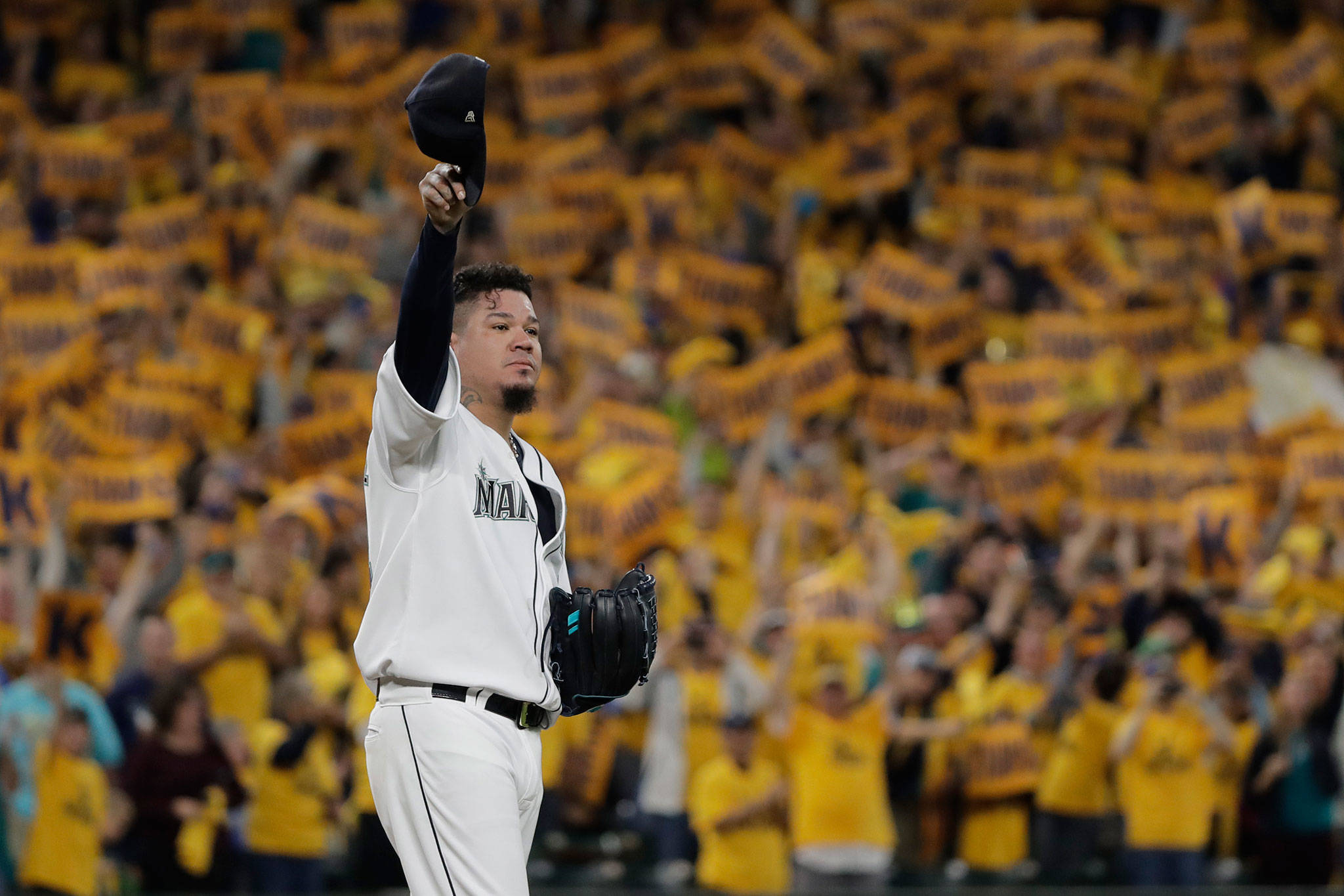 With the “King’s Court” cheering section behind him, Mariners starting pitcher Felix Hernandez tips his cap as he takes the mound for a game against the Athletics on Sept. 26, 2019, in Seattle. (AP Photo/Ted S. Warren)