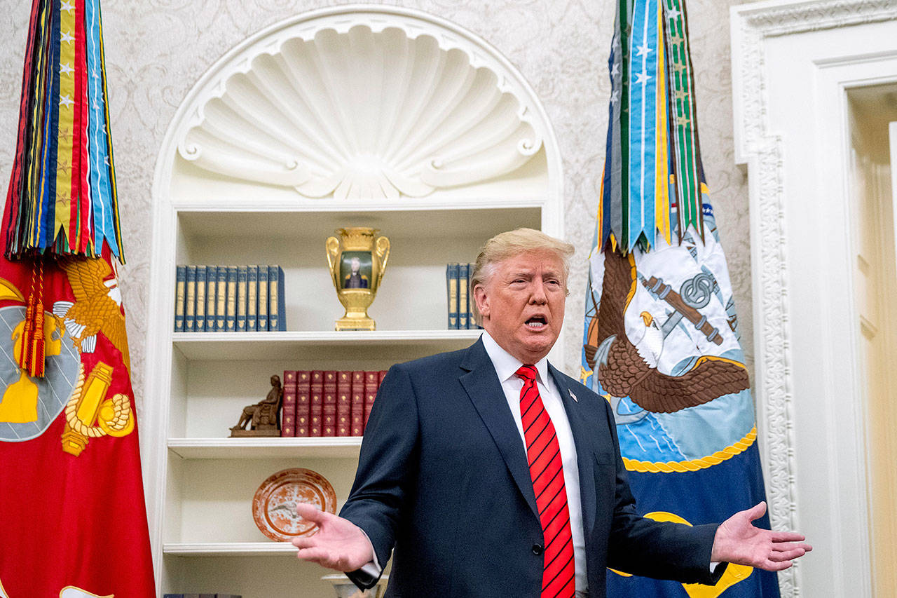 President Donald Trump speaks to member of the media Monday as he departs a ceremonial swearing in ceremony for new Labor Secretary Eugene Scalia in the Oval Office of the White House in Washington. (AP Photo/Andrew Harnik)