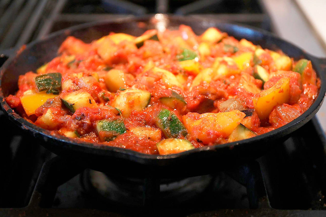 Ratatouille typically consists of roughly equal amounts of eggplant, zucchini and bell pepper, flavored with onion, garlic and herbs. Tomato is added in direct proportion to the cook’s tastes. (Terrence Antonio James/Chicago Tribune)