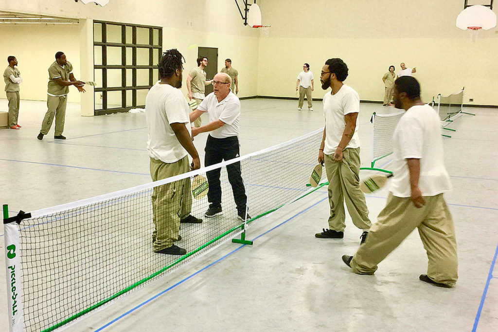 Edmonds pickleball player Roger BelAir, 72, has been to the Cook County Jail in Chicago three times since 2017 to teach the game to inmates. He says it builds teamwork and relieves stress. He has taught the game at other prisons, paying for the trips himself. (Submitted photo)
