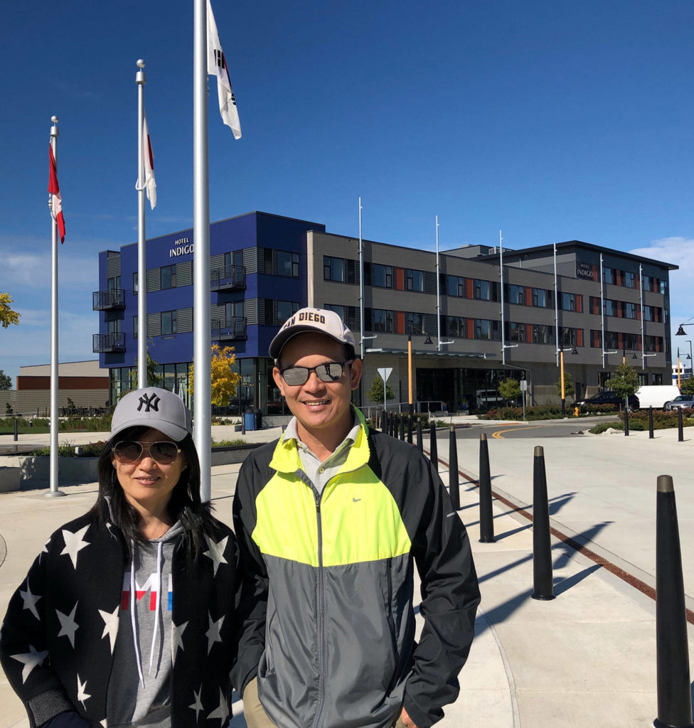 Wade Lam and his wife, Judy Zhou, visiting from Hong King, are staying at Hotel Indigo, which opened Tuesday. (Janice Podsada / The Herald)
