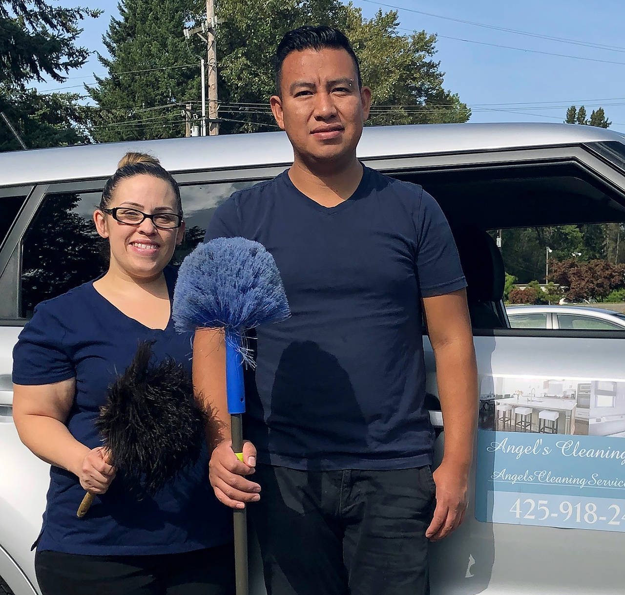 Janice Podsada / The Herald                                 Silver Hernandez, owner of Angel’s Cleaning Service in Lynnwood, and her husband, Cesar Lopez, take a break from cleaning.