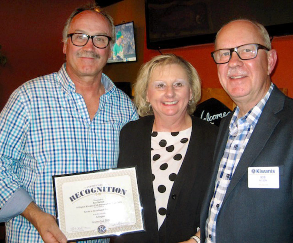 The Kiwanis Club of Arlington honored Rex Bartlett as Citizen of the Year. Left to right, Rex Bartlett, his wife, Cindy, and Bob Nelson, Kiwanis president. (Submitted photo)
