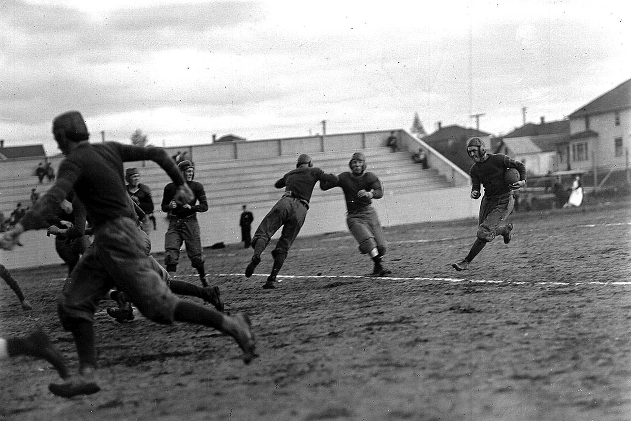 The Everett High School team in action. The game against Bellingham took place Oct. 4, 1913, at Athletic Park Field. Dan Michel is carrying the ball. (Photo by J. A. Juleen/Courtesy of the Everett Public Library)