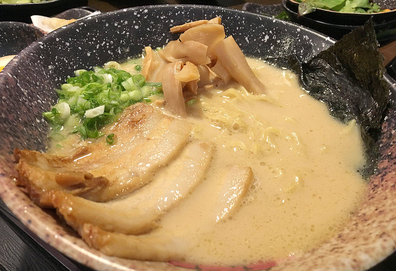 The tonkotsu bowl at Botan Ramen n’ Bar in Everett has a rich bone broth and slices of chashu pork, green onion and aged bamboo shoots. (Ben Watanabe / The Herald)