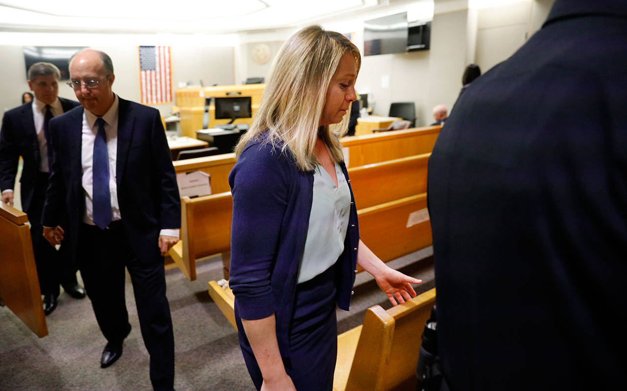 Fired Dallas police officer Amber Guyger leaves the courtroom after a jury found her guilty of murder Tuesday in Dallas. Guyger shot and killed Botham Jean, an unarmed 26-year-old neighbor in his own apartment last year. She told police she thought his apartment was her own and that he was an intruder. (Tom Fox/The Dallas Morning News via AP, Pool)