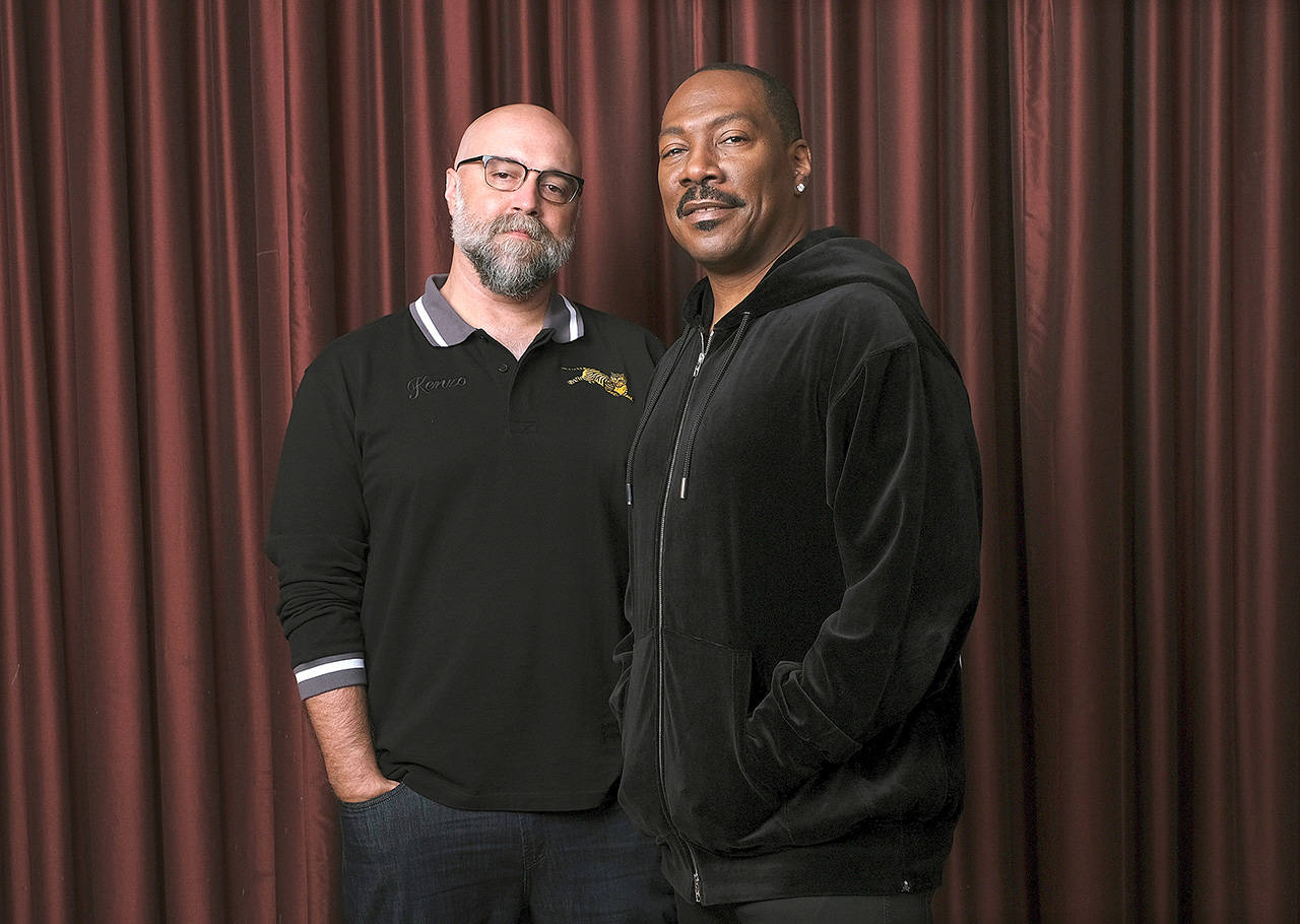 Eddie Murphy (right), star of the film “Dolemite Is My Name,” poses with director Craig Brewer at the Shangri-La Hotel during the Toronto International Film Festival in Toronto. (Associated Press)