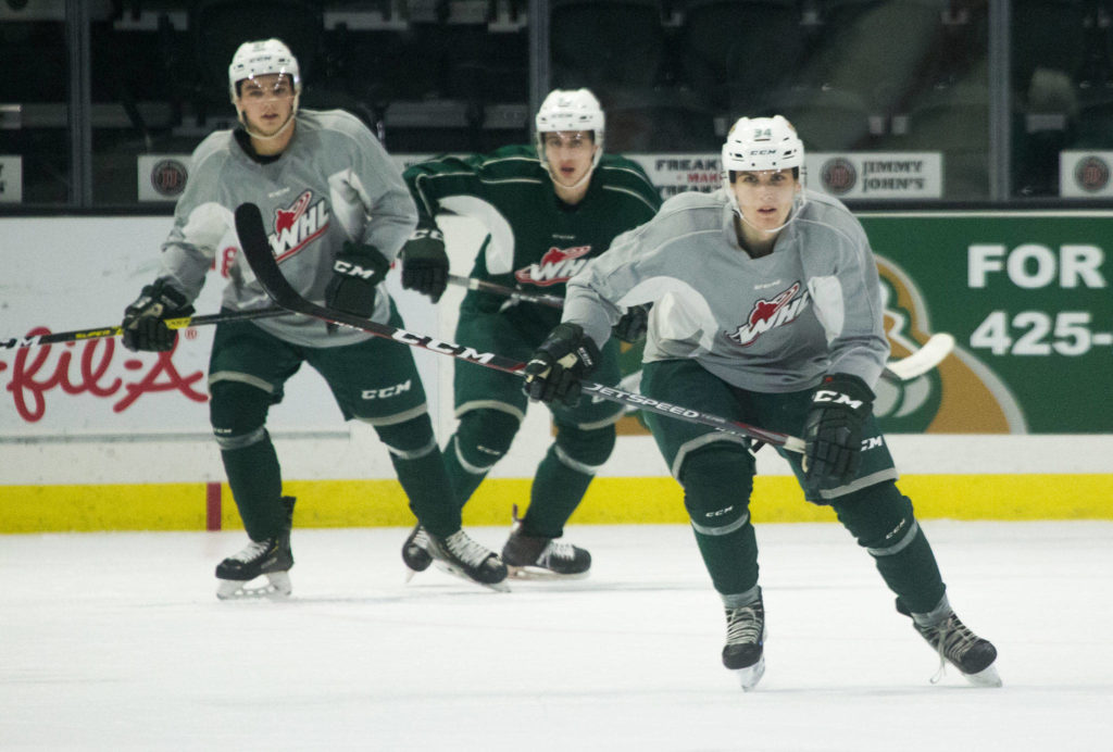 The Silvertips’ Tyson Phare (right) practices with the team on Oct. 3, 2019, at the Angel of the Winds Arena in Everett. (Andy Bronson / The Herald)
