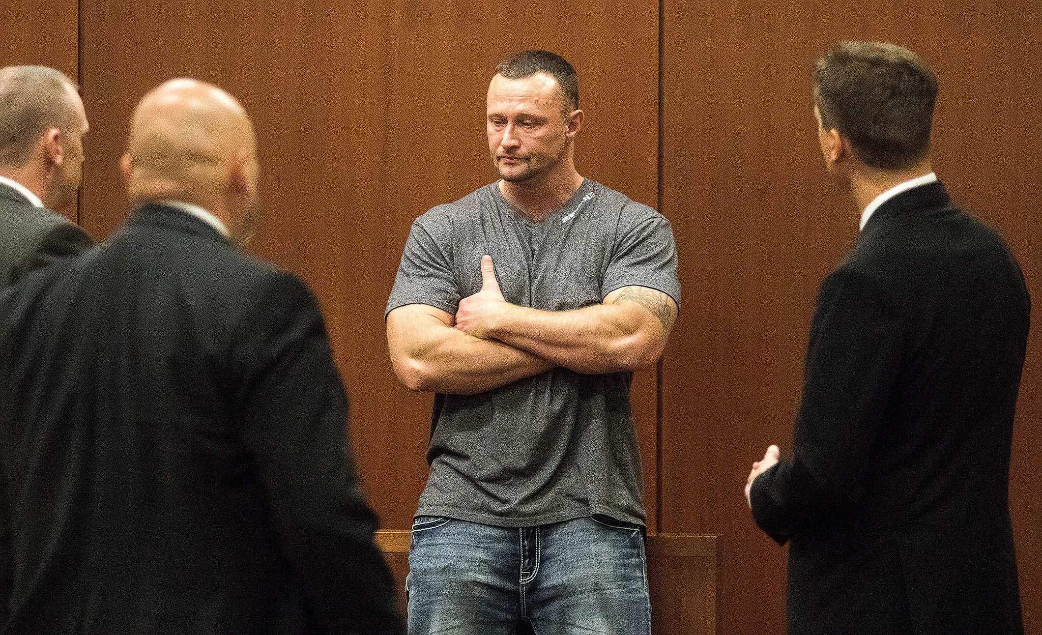 Emotional after hours of testimony, Lance Cleator takes a break before more questioning by Deputy Prosecutor Matt Hunter (right) in the Anthony Garver murder trial in the Snohomish County Courthouse on Wednesday in Everett. (Andy Bronson / The Herald)